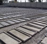 Cement, silica sand, and aggregate bins at manufacturing plant