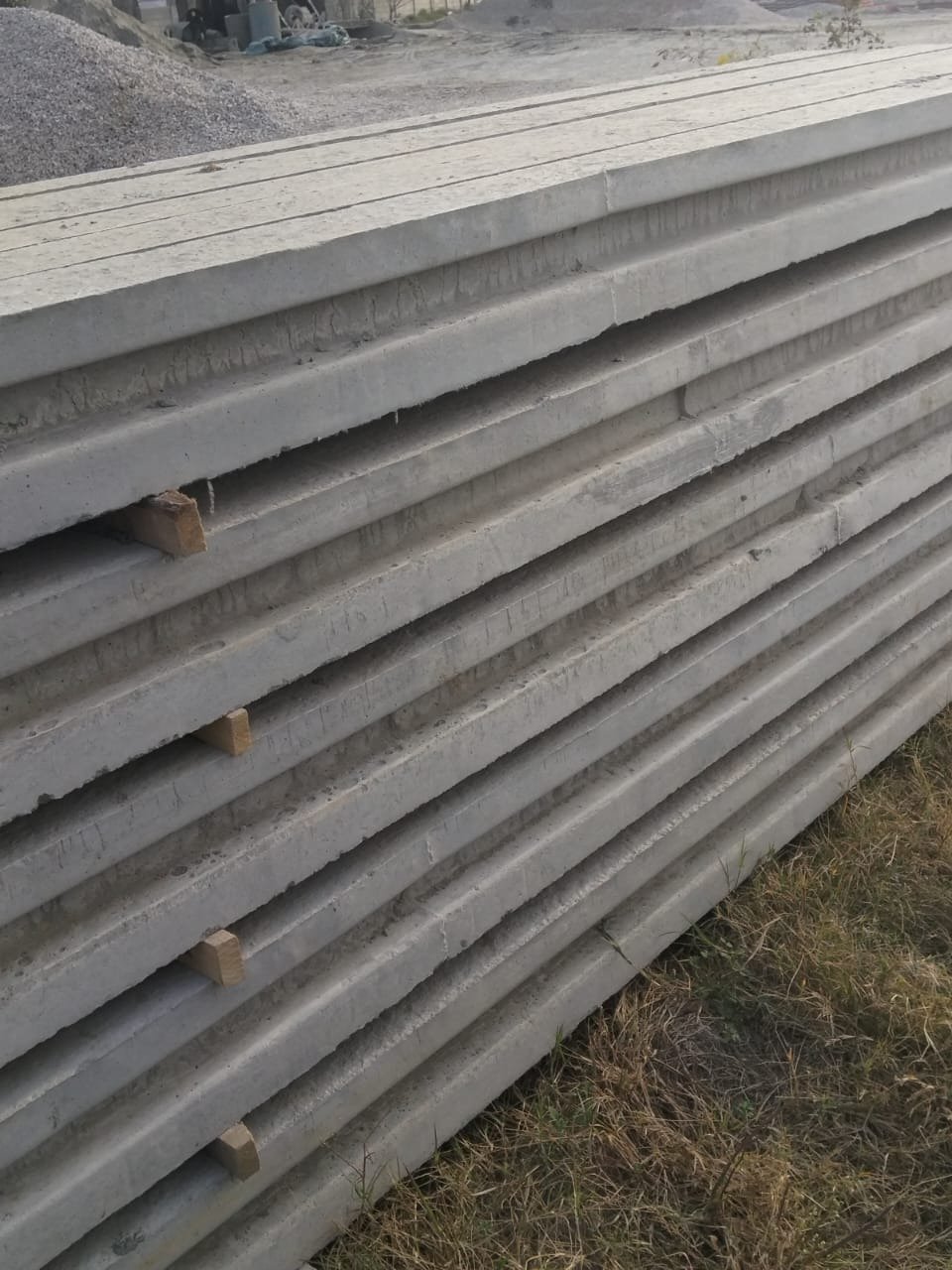 Al Quraish installation technicians fitting boundary wall panels at site